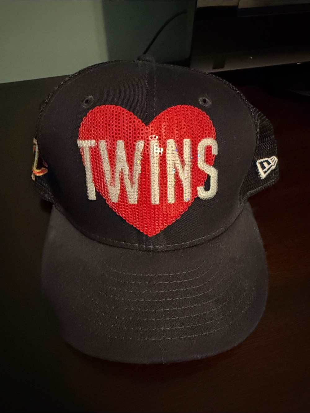 Genuine Merchandise Black Cap with “Twins” Red & Blue Logo.
